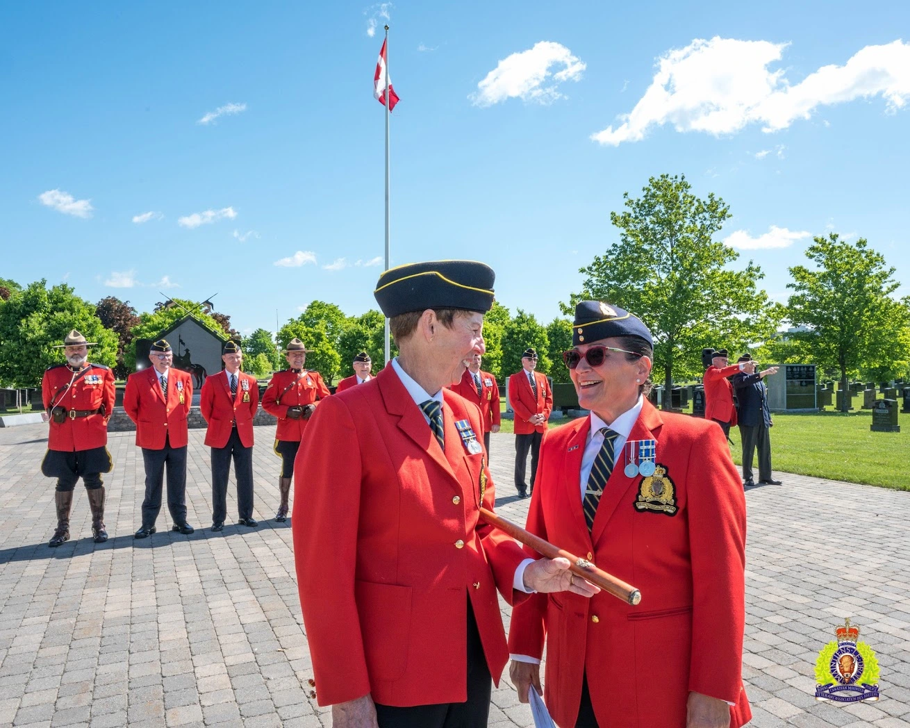 RCMP Veterans Chris Windover (left) and Luisa Russo-Lemay (right) conferring before calling the ceremonial troop together for the annual vigil ceremony at RCMP National Memorial Cemetery at Beechwood, Ottawa, Ontario. May 23, 2024.